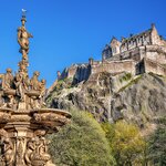 Edinburgh Castle surrounded by budding trees in April
