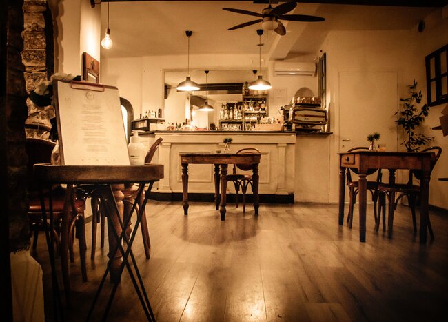 Sit down to a cozy evening meal (photo courtesy of Muralto Bistrot)