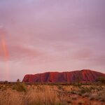 A rainbow over Uluru in Australia's Outback