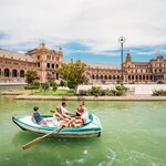Row the family on Plaza de España in Seville