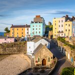 Tenby's beautiful pastel houses and sandy seafront make for a popular destination 