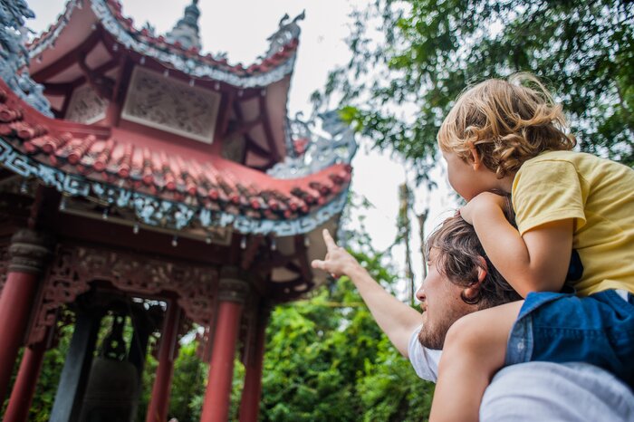 Father and son visiting a Vietnamese pagoda