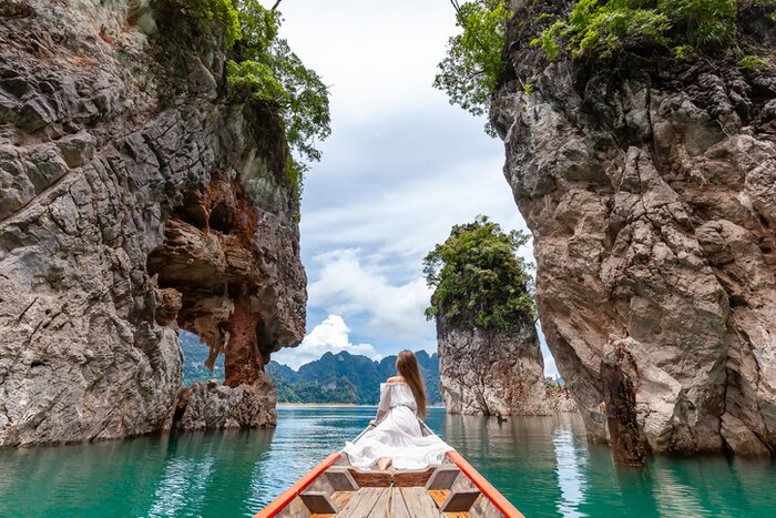 Boat throught the aquamarine lakes of Khao Sok National Park