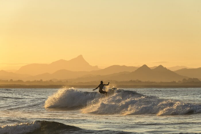 Stay two nights in Byron Bay for sunrise beach walks, kayaking, and surfing