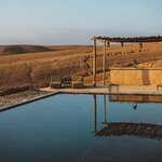 Experience the remote beauty of the Agafay Desert from a luxury camp