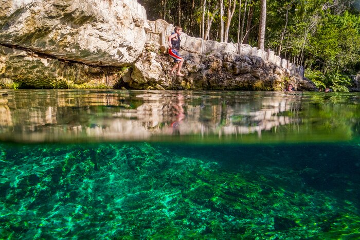 Take the kids to a cenote for a fun splash