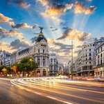 Madrid's Calle Gran Vía lights up at dusk