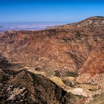 Dana Biosphere Reserve is the largest nature reserve in Jordan, encompassing desert mountains, sandstone cliffs, and fertile valleys