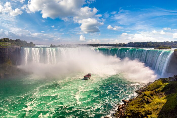 Feel the mist and hear the thunder of Niagara Falls' Horseshoe Falls on a eastern Canada itinerary