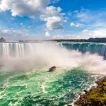 Feel the mist and hear the thunder of Niagara Falls' Horseshoe Falls on a eastern Canada itinerary