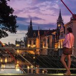 Enjoy free time to explore Ghent's picturesque canals and colorful buildings