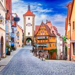 Wander Bavaria's medieval streets of Rothenburg ob der Tauber to Siebers Tower and Kobolzell Gate amid half-timbered buildings