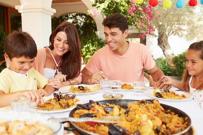 Even the youngest members of the family can get involved in making delicious paella