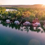 Cruise along the tranquil Tatai River to get to a luxurious "glamping" destination (photo courtesy of Canvas & Orchids Retreat)