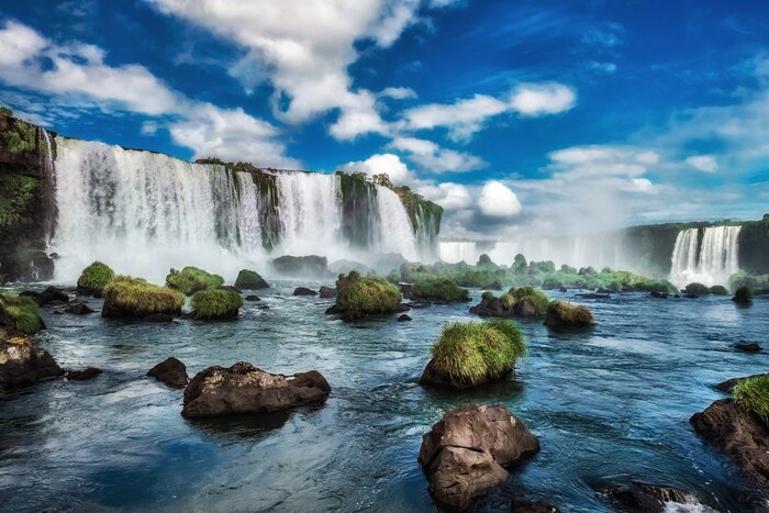 Stand at the edge of Iguaçu Falls, then take a boat trip to its base