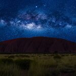 Uluru at night under the Milky Way in Kata Tjuta National Park in August