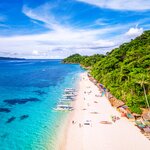 Relax on the white sand of Puka Beach in Boracay