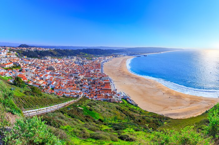 Take to the west Atlantic coast, like Nazaré to avoid the throngs of local and foreign travelers