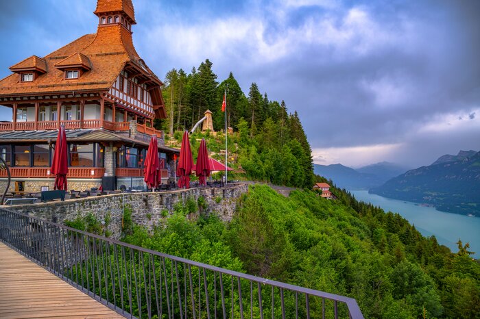 A summer view of Lake Brienz and the surrounding Alps from the Harder Kulm restaurant terrace