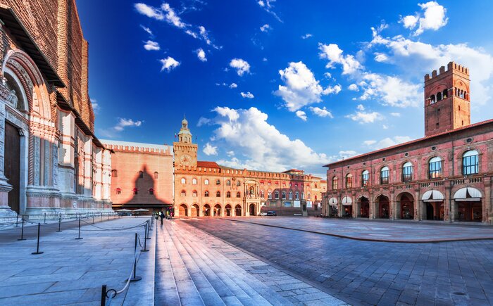 Catch a morning sunrise over Bologna's Piazza Maggiore