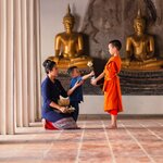Meet monks and tour impressively ornate temples to learn about Thai customs on a family holiday