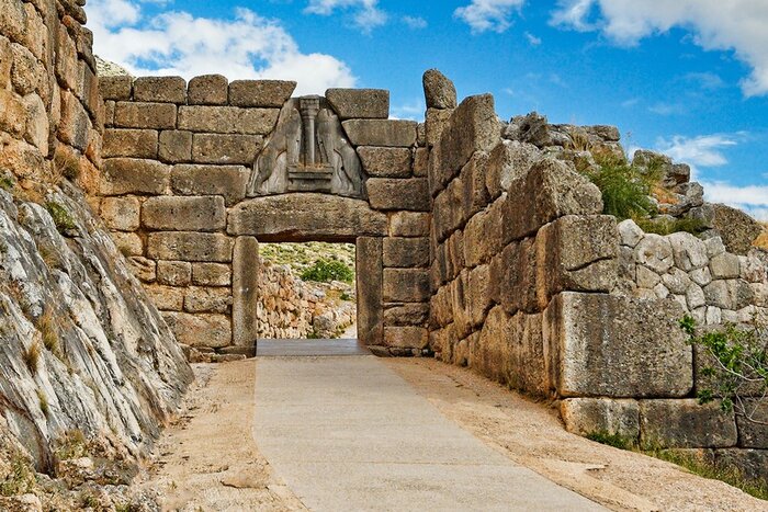 Pass through the Lion Gate at Mycenae, said to have been the home of Agamemnon