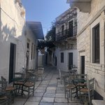 We ate a snack at a beachside tavern and then headed back to the mountains to the village of Halki.  It was filled with galleries and shops, including the famous Fish and Olive gallery, featuring work by a Naxian potter and her husband painter. | Photo taken by Kris M