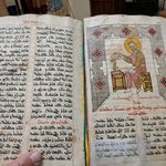 This Bible is written in the original Aramaic - on papyrus, which we got to touch! The sexton is also one of the soloists, so he sang us a beautiful hymn of praise - again in the original Aramaic.  - Syrian Orthodox Church of the Virgin Mary. Bethlehem, Palestine | Photo taken by Rich W