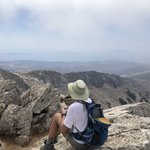 At the top we found a westward spot to see glimpses of the sea as we ate our snacks. | Photo taken by Kris M