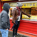 David (guide) pointing out his favorite hotdog at 'historic'  hot dog stand | Photo taken by Robin W