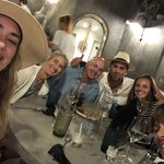 Our first dinner together was so much fun. We walked along the rim of the caldera with Aubrey leading the way and then into streets and alley ways to our dining spot.  On the way back home, in the dark, we made a line and proceeded to do an Indian run, until Aubrey tripped and volleyball rolled into the shrubs!  We enjoyed more of the evening on our deck when we got back to our cave homes. | Photo taken by Kris M