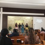 The Filipino ladies lead out in the singing. | Photo taken by Linley V