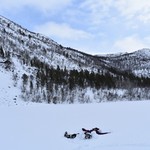 making a snow angel while ice fishing | Photo taken by Cyndi P