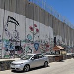 There are political murals painted on the Palestinian side of the border wall with Israel, and it’s an interesting perspective to see how Palestinians have to live such restricted lives.   For Israelis, this is a security wall, which protects them from Palestinian attackers trying to enter Israel.   For Palestinians, this is the cold reality: a concrete, 430-mile, 25-feet high cement barrier demarcating what they see as apartheid.   - Bethlehem, Palestine | Photo taken by Rich W