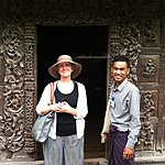 Jane and Nay in front of a teak carved door. | Photo taken by Rodney S