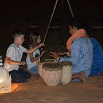 The kids playing music while glamping at the Sahara | Photo taken by mirsini t