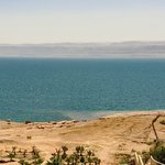 This is the view of the Dead Sea from our hotel room. We walked down to bob and float in the Dead Sea. With its high salt content of 35% (most oceans are in the 5-15% range), a person just floats without any motion or effort. The Dead Sea is actually a lake, with water flowing into it from the Jordan River and with no outlet to the ocean. Consequently, its landlocked nature causes the water to evaporate and leave behind massive amounts of salt. | Photo taken by Rich W