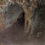 Jesus’ tomb. Around the back of the Edicule is the Coptic Chapel that contains carved cave-like tombs, one of which the Coptics believe is Jesus’ tomb. There are very long lines to enter the ornate Roman Catholic Edicule, but short – or no – lines for the Coptic cave.  - Church of the Holy Sepulchre, Jerusalem, Israel | Photo taken by Rich W