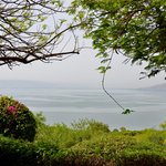 The synagogue in Capernaum overlooks the Sea of Galilee, with the Golan Heights on the far shore.  - Capernaum, Israel | Photo taken by Rich W