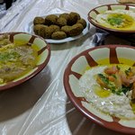 The only menu choices at Hashem are falafel, Jordan beans, baba ghanoush, and hummus – and a non-alcoholic beverage. We had all the dishes and their complimentary tea for total cost, including gratuity, for two people of about $8 USD. Delicious and inexpensive! | Photo taken by Rich W