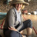 Annette modeling the latest in Myanmar bamboo hats | Photo taken by Gregory R