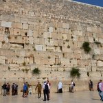The Western Wall is an ancient limestone wall of the Old City of Jerusalem, and it is considered holy due to its connection to Temple Mount. The wall is part of the retaining wall erected by Herod in 20 BCE to support the vast plaza on which he rebuilt the Temple, so it is venerated as the sole remnant of the Temple on the Mount.  The wall is sometimes referred to as the Wailing Wall, likely due to the anguished prayers of ultra-Orthodox Jewish men as they read the Torah. | Photo taken by Rich W