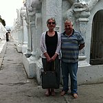 Buddhist temple hidden behind two tourists. | Photo taken by Rodney S