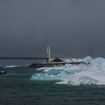 Glacier lagoon with bridge in background.  Diamond beach on other side of road. | Photo taken by Grace L
