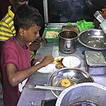 Street food delivered by the smartest young fella you ever were served by ✅ | Photo taken by Vicky V