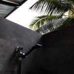 Athigira River Camp deluxe tent outdoor shower | Photo taken by Karyn R