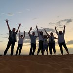 Our sense of accomplishment for climbing 1 out of endless sand dunes in the Sahara :) | Photo taken by mirsini t