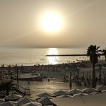 Many people gather at watch the sunset at the beaches in Tel Aviv. There are loads of restaurants and bars, as well as vendors who rent chairs, lounges, and umbrellas at the beach. | Photo taken by Rich W
