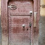 Door with two knockers and the hand of Fatima | Photo taken by jaclyn m