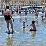 Everyone is enjoying the Miroir d’Eau on a hot summer day | Photo taken by Gigi G